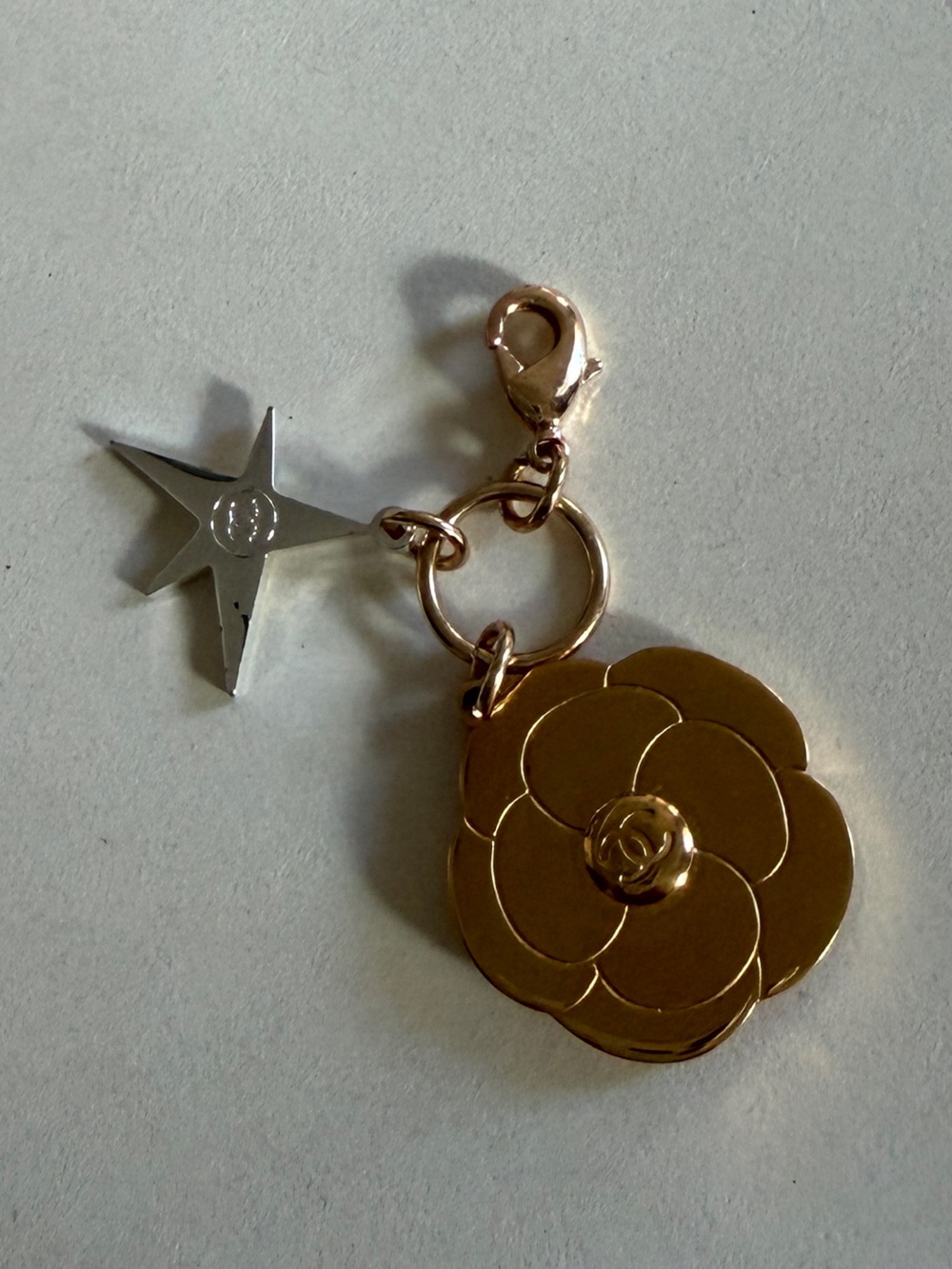 CHANEL Gold Camellia Flower Charm Keychain with Silver Star Accent